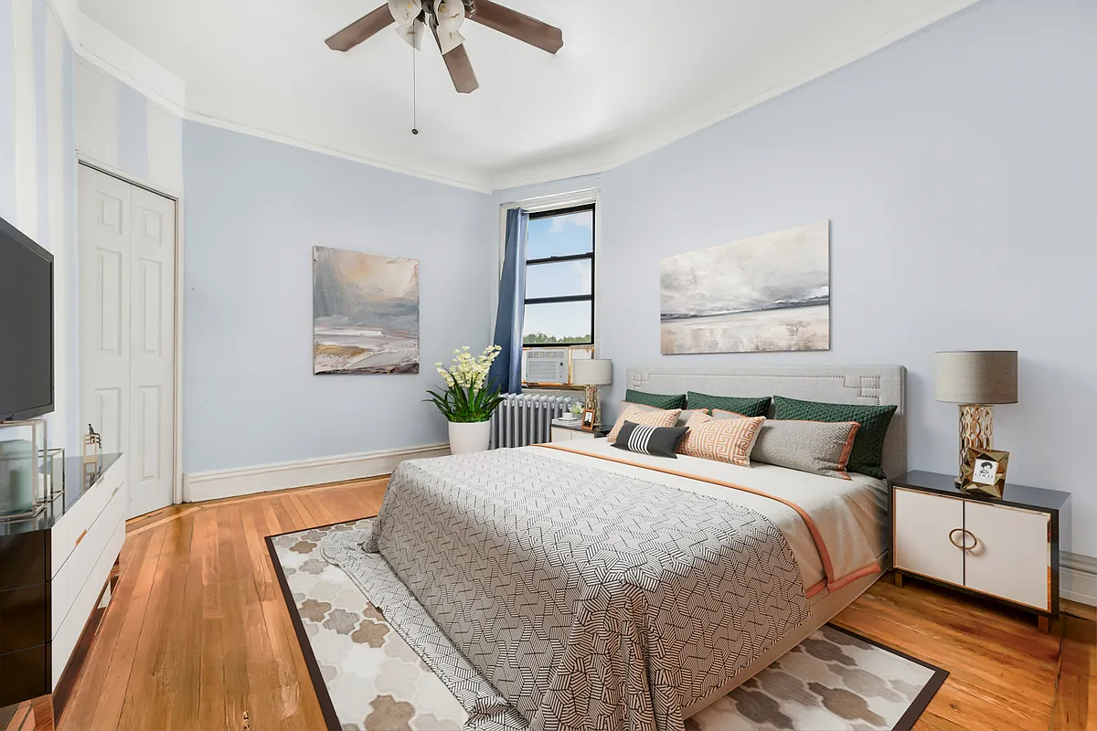 virtually staged bedroom with a ceiling fan