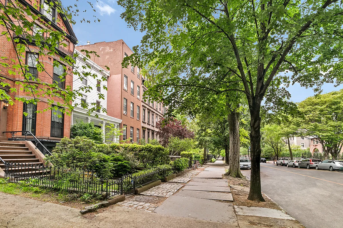 ivew of street showing brick and wood frame houses