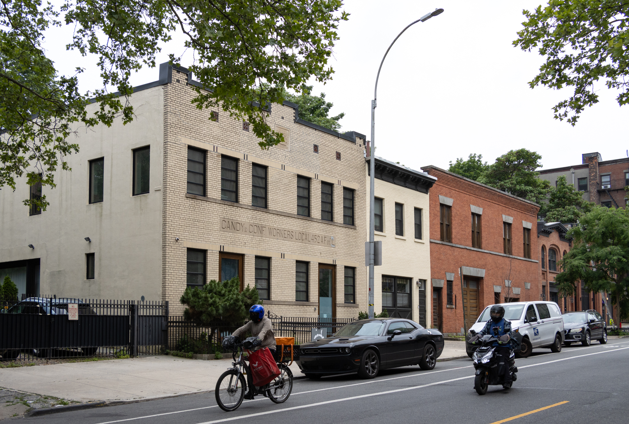 a pale brick building with a candy union sign