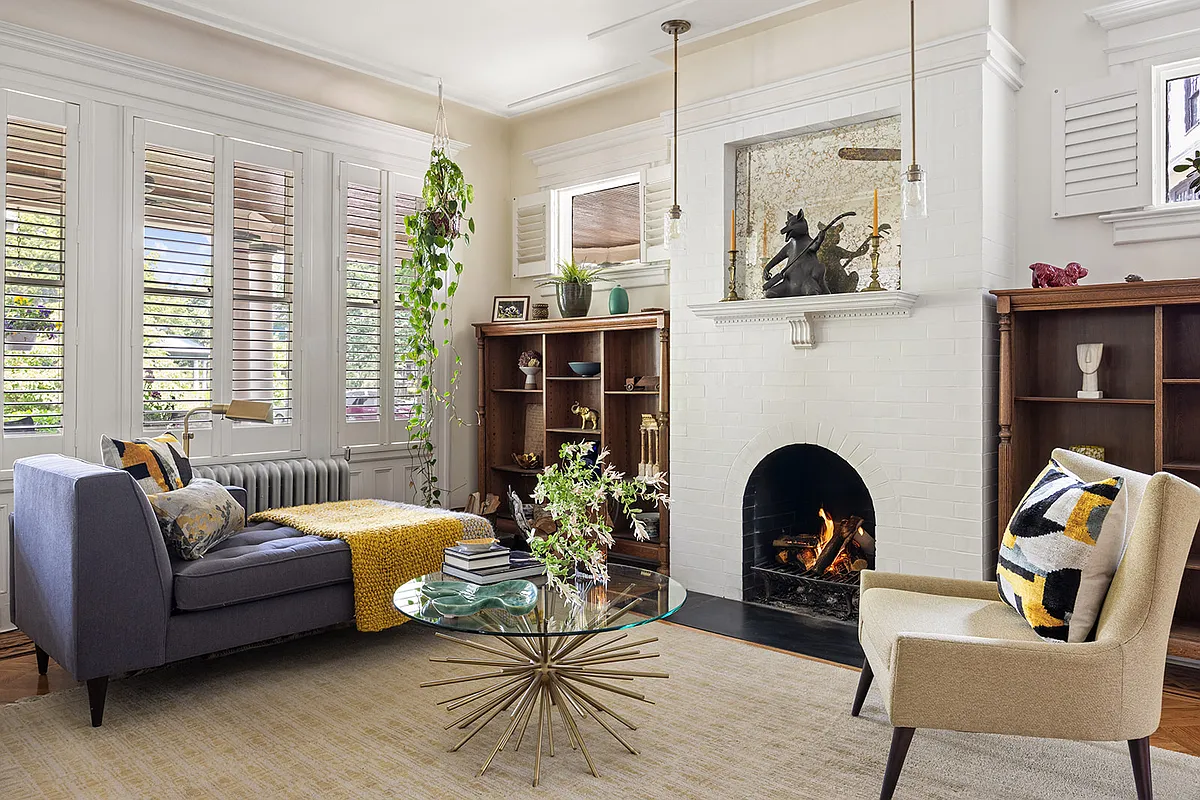 living room with tile-faced fireplace