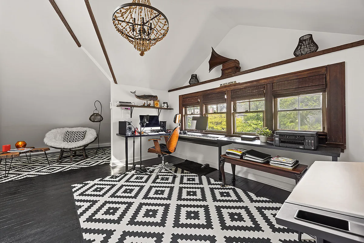 top floor studio space with black painted floor, white walls