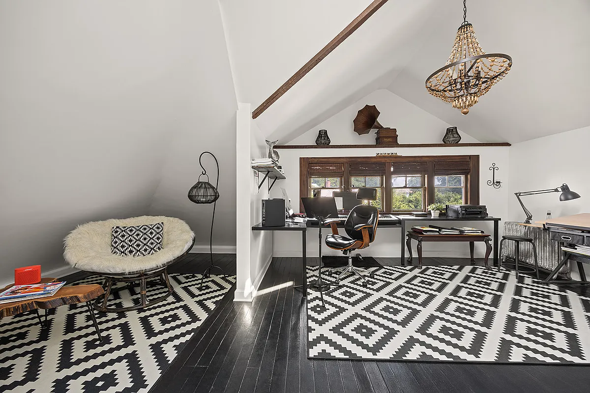 top floor studio space with black painted floor, white walls
