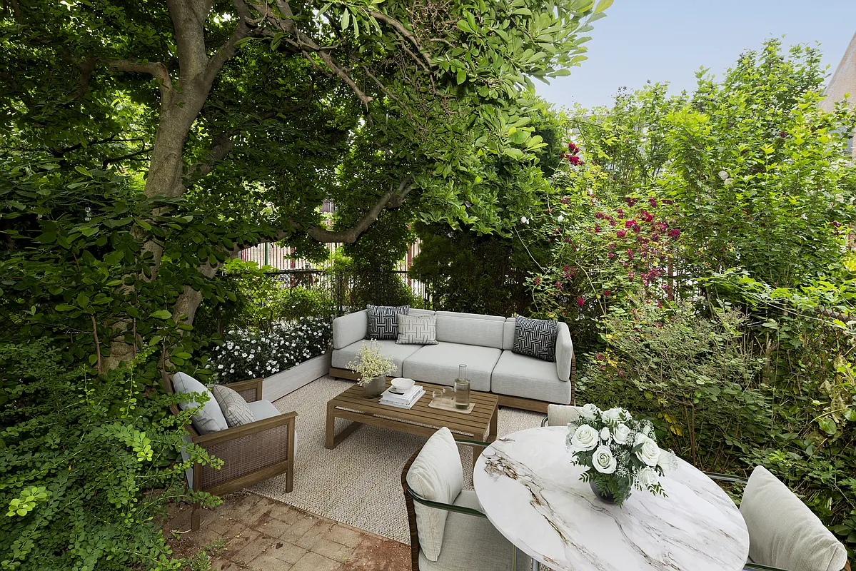 virtually staged rear yard with sofa, dining table