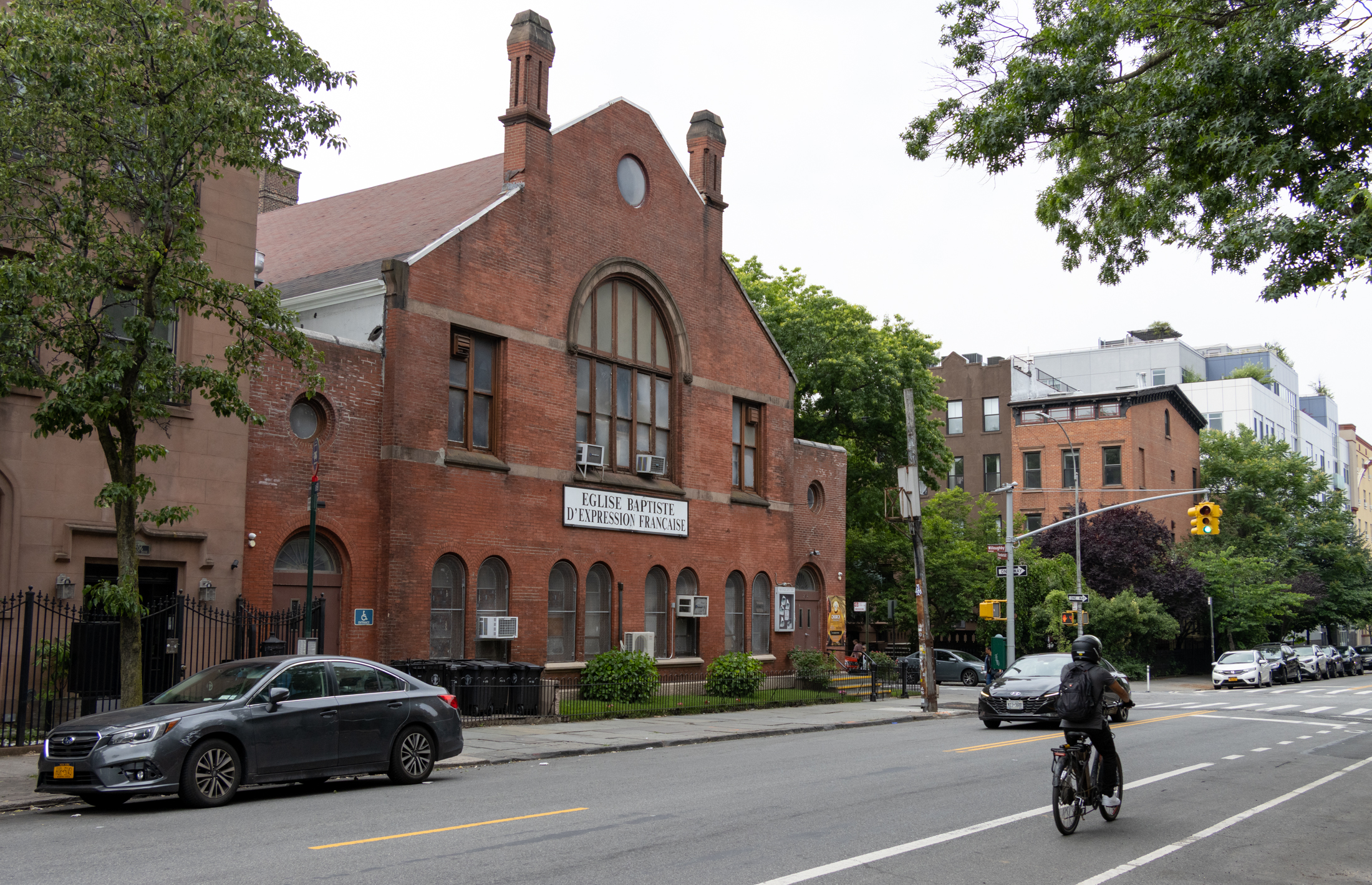 brooklyn - streetview of clermont avenue with church at 209 clermont and a person on a bike