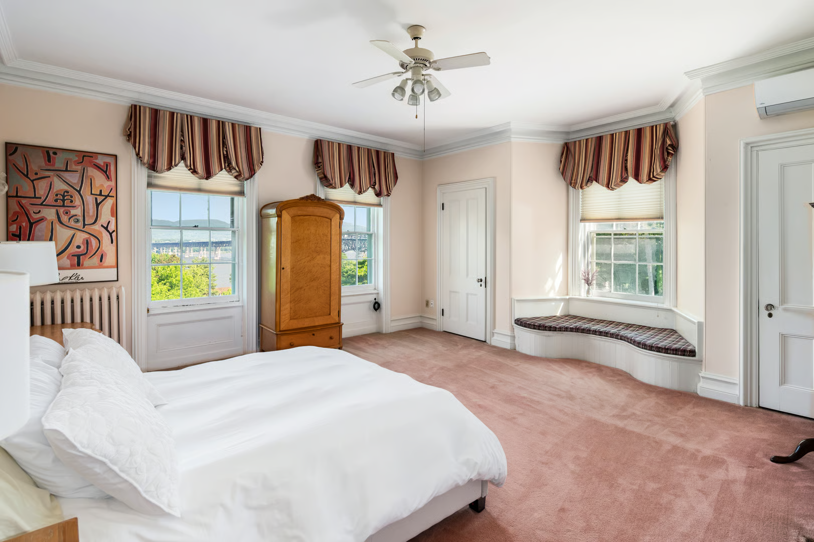 bedroom with wall-to-wall carpet, ceiling fan, window seat