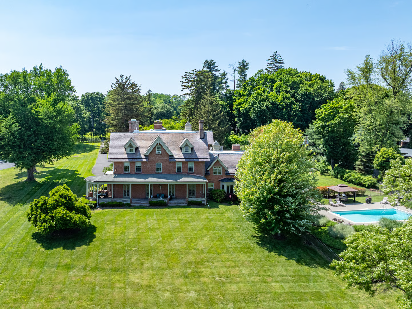 aerial view of the house showing the large lawn and a pool