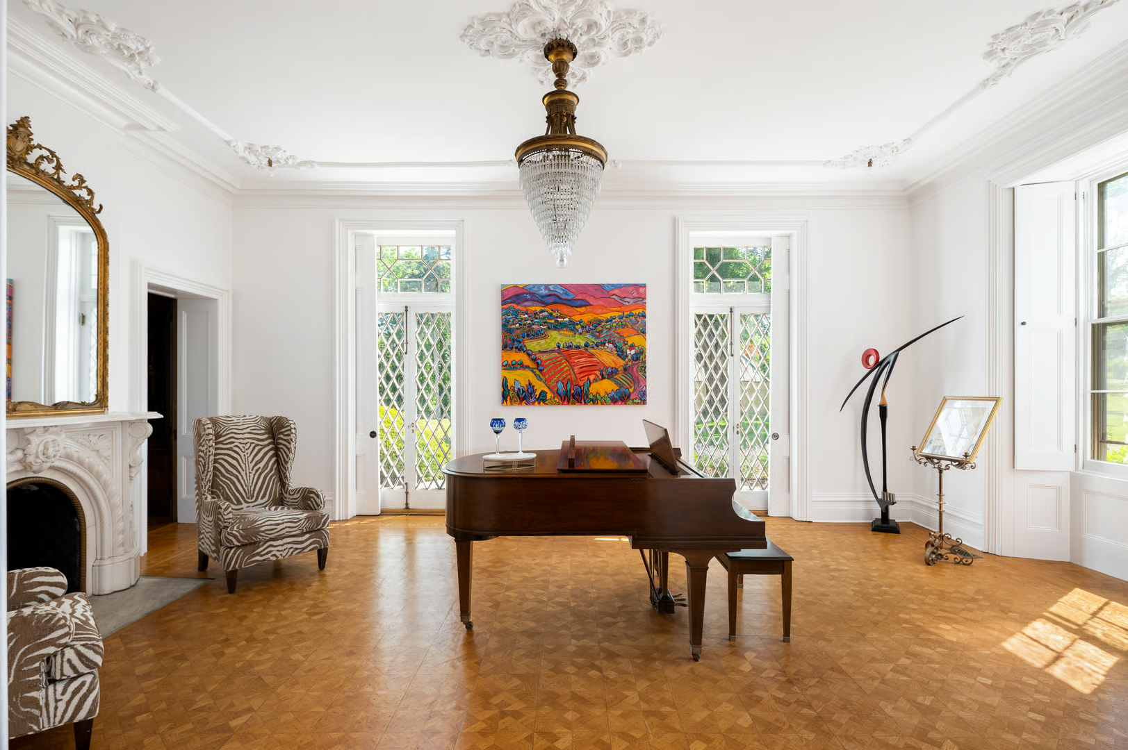 parlor with marble mantel, plasterwork, french doors