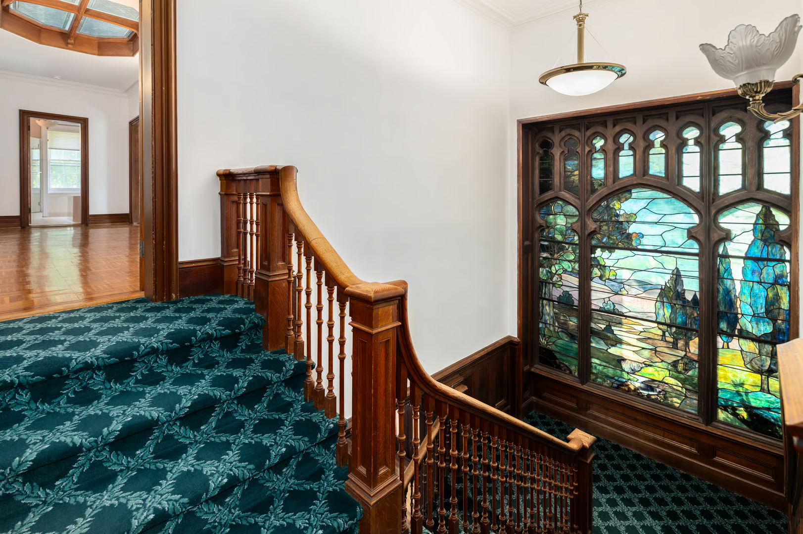 stair with view of stained glass window