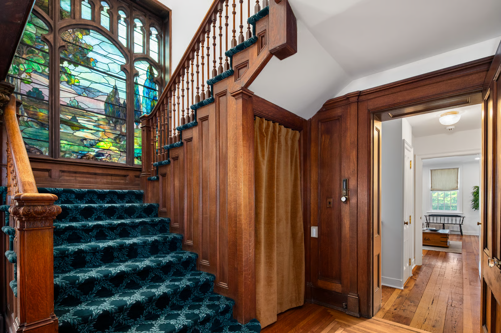 stair with stained glass window at landing