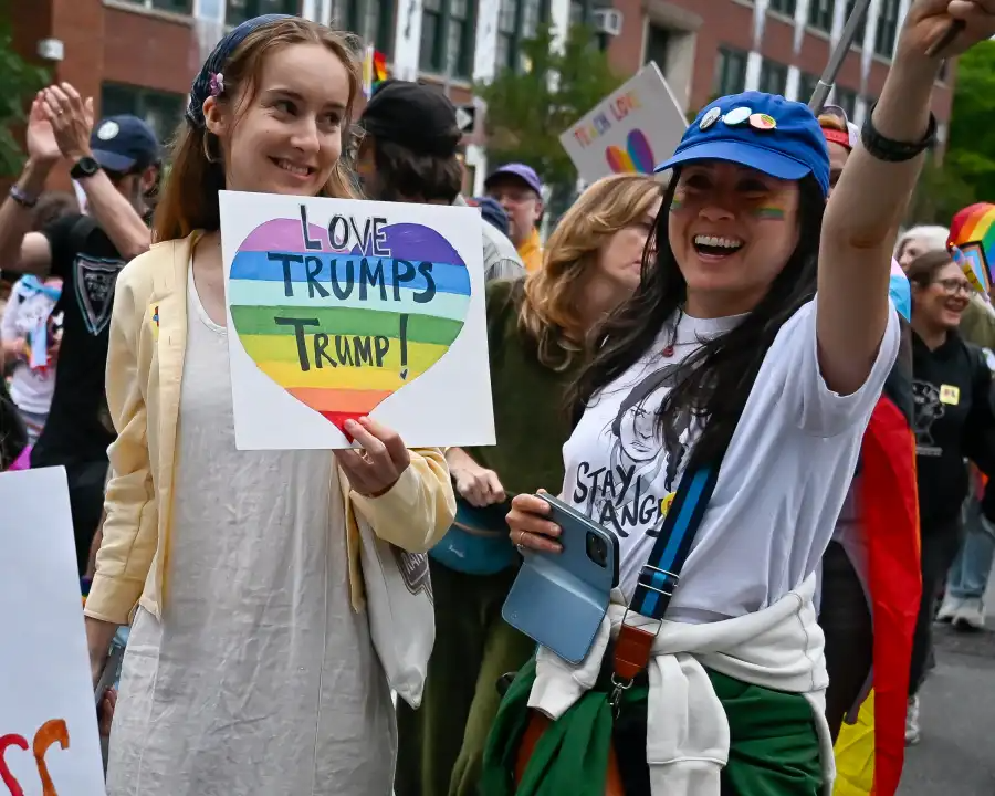 Colorful signs line the Brooklyn Pride parade route, celebrating love, identity and inclusion.