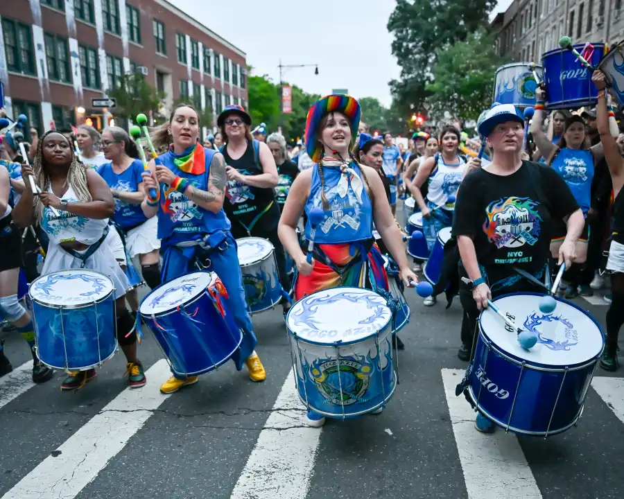 Members of Fogo Azul, an NYC-based LGBTQ+ drum line, bring rhythm and energy to the Brooklyn Pride parade.