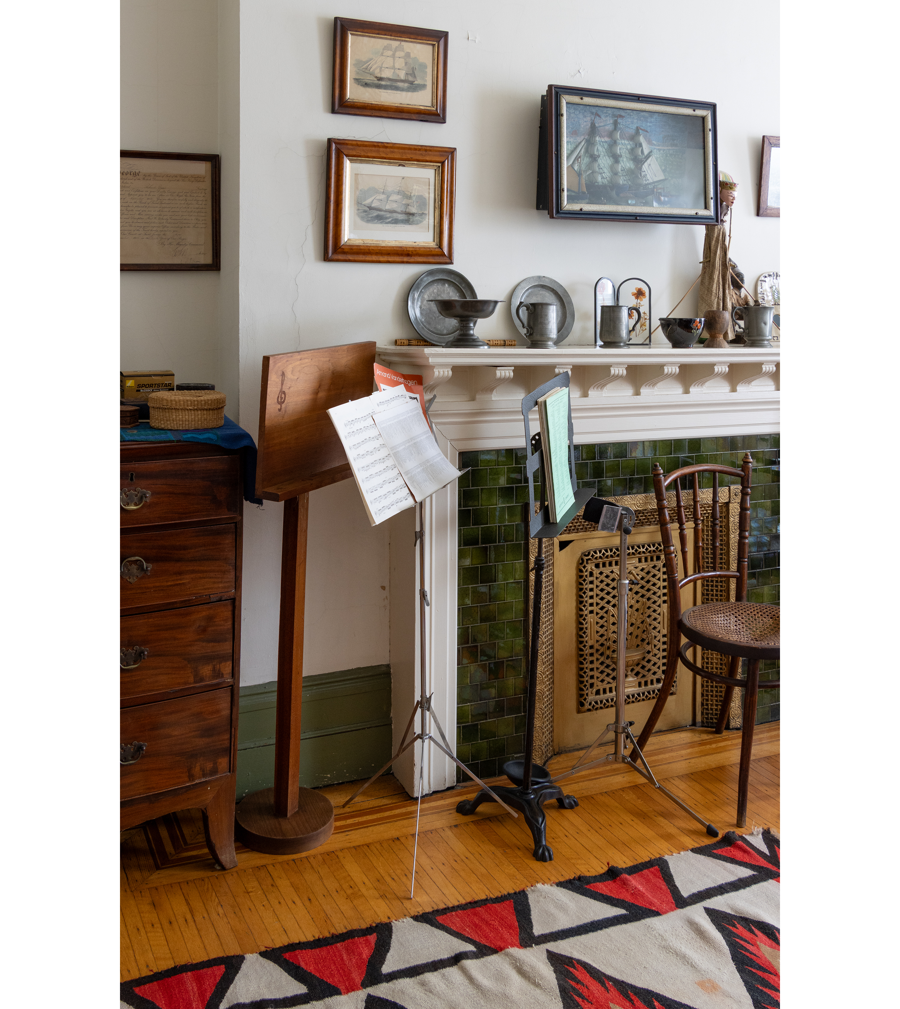 a music room with a mantel and a music stands