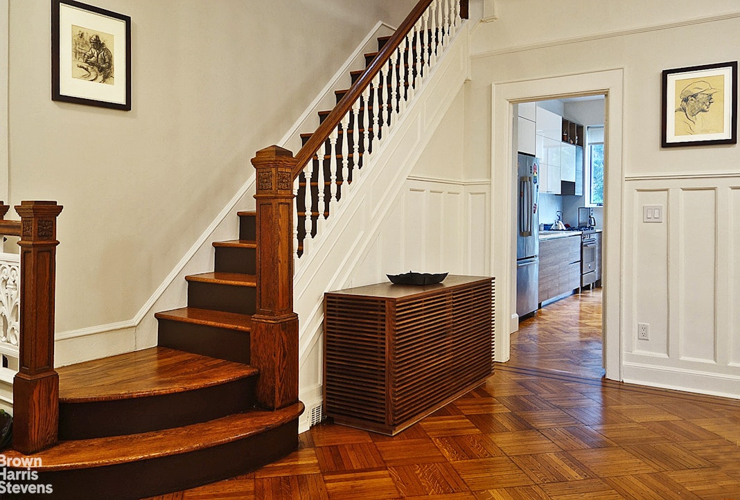 middle parlor with wainscoting, stair
