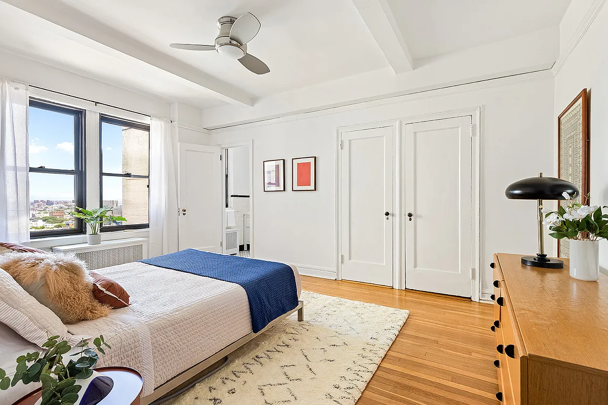 bedroom with wood floor, en suite bath