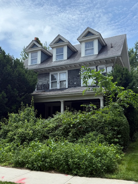 standalone house with columned porch