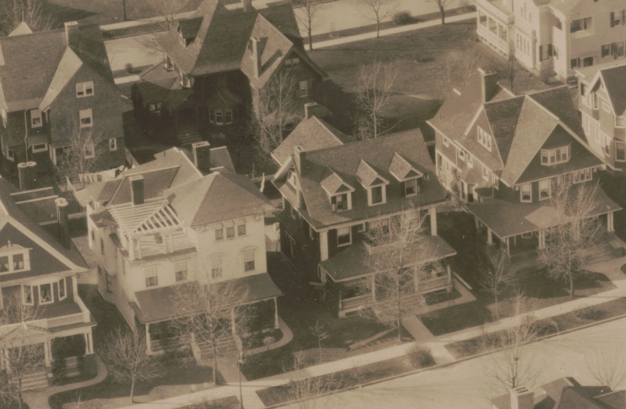 The house, identifiable by the three dormers in its roofline, can be seen in this circa 1907 photo of the neighborhood.