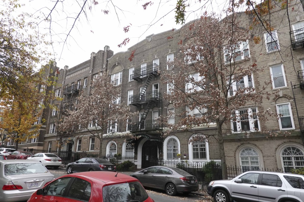 the brick walk-up building 
