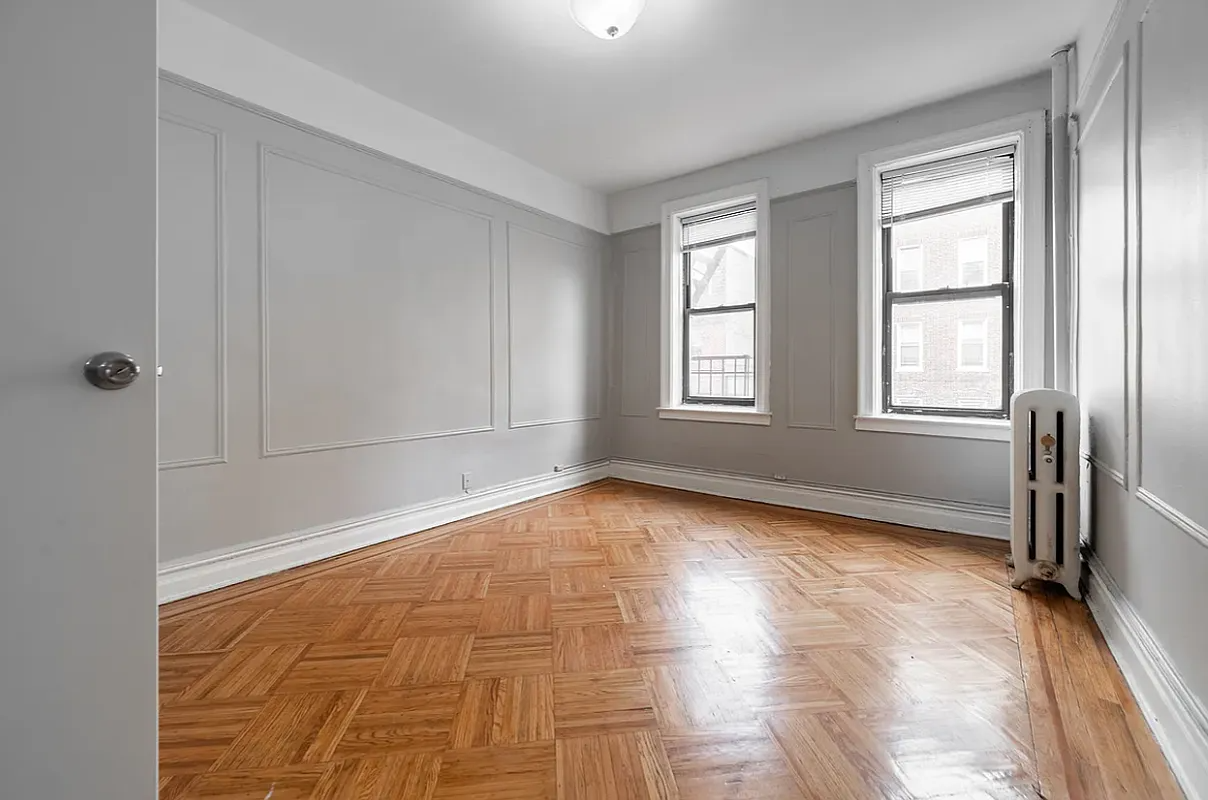 bedroom with gray walls with moldings