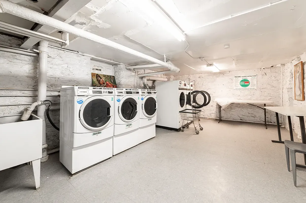 laundry room with multiple washing machines