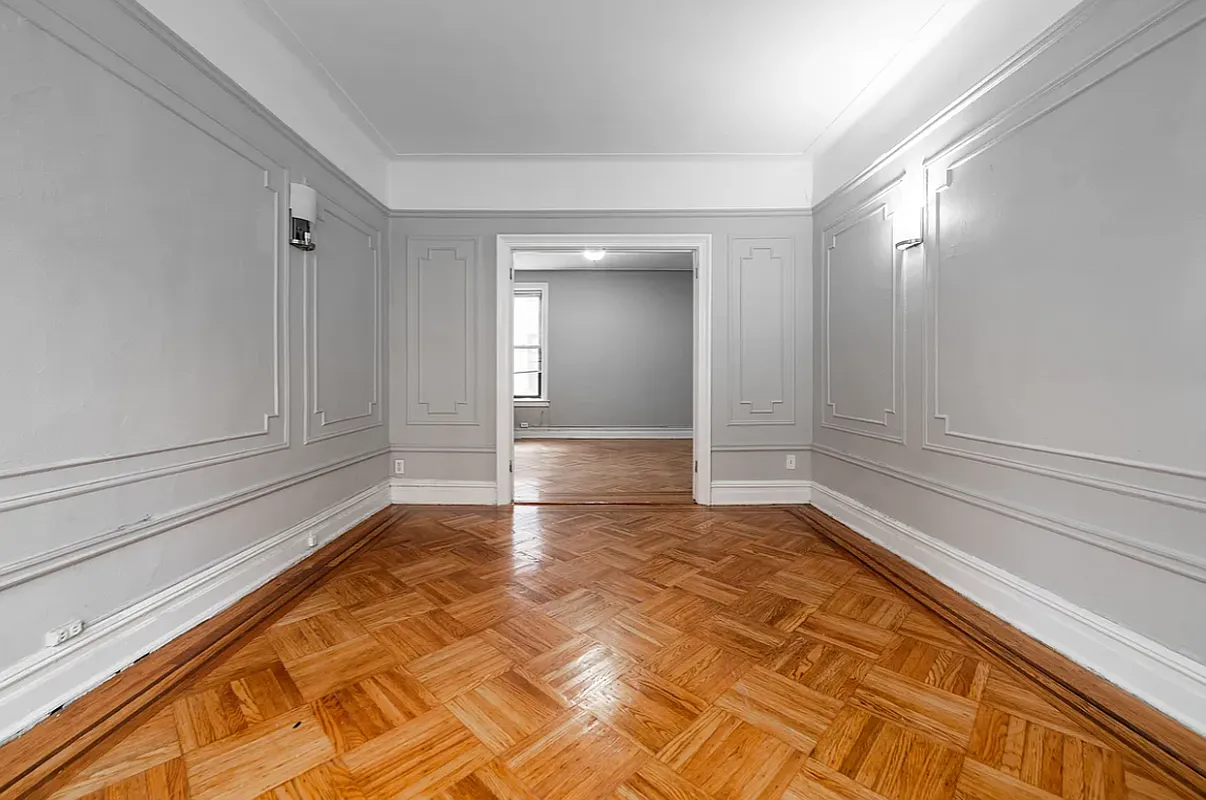living room with gray walls and wall moldings