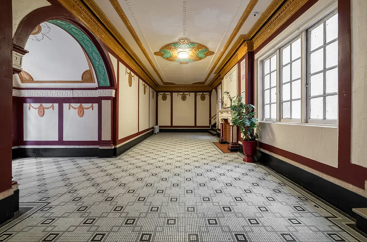 lobby with tile floor, wall decorations