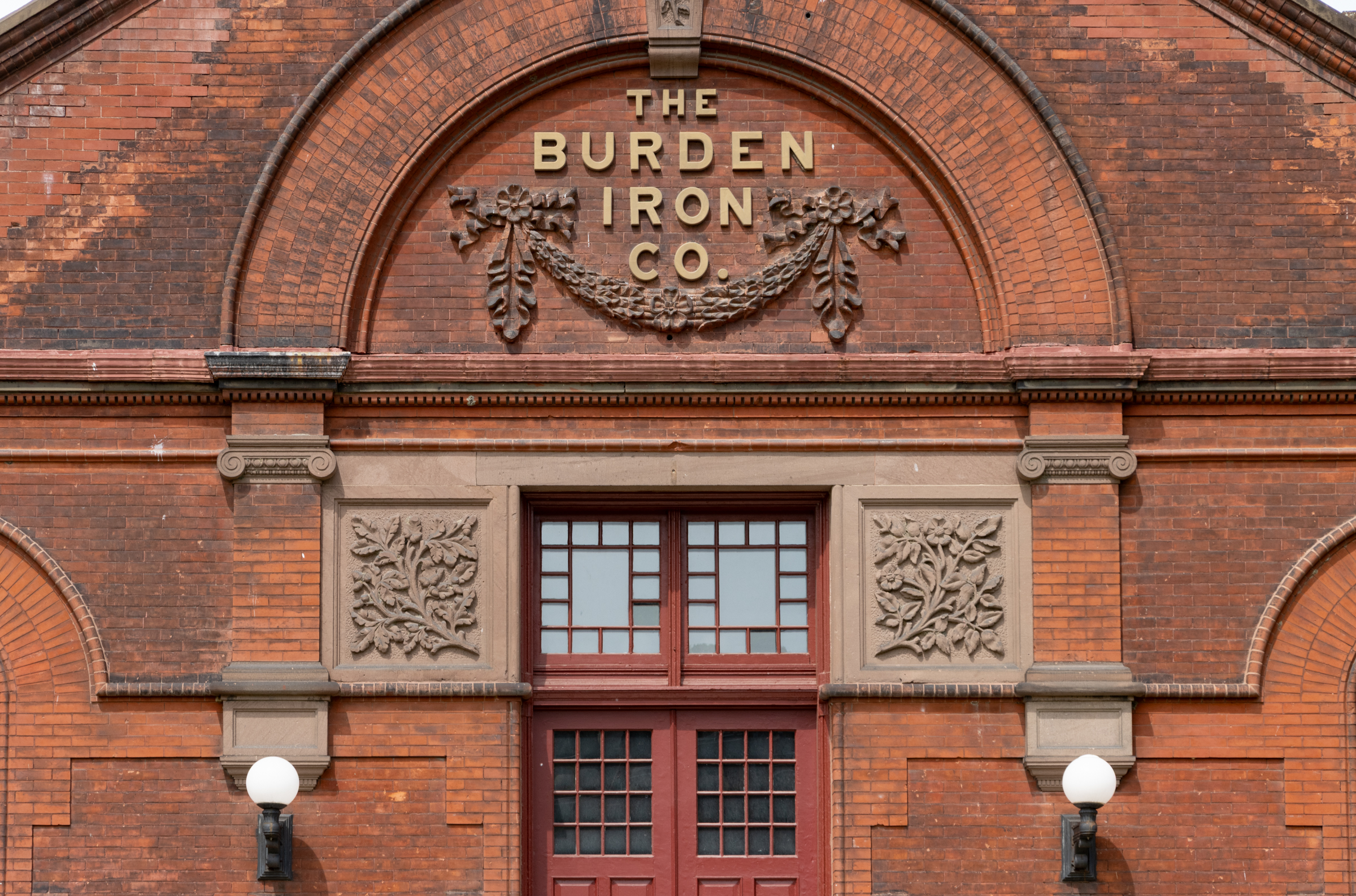entry with sign for burden iron works