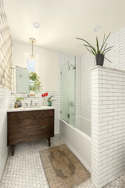 bathroom with white subway tile, wood vanity