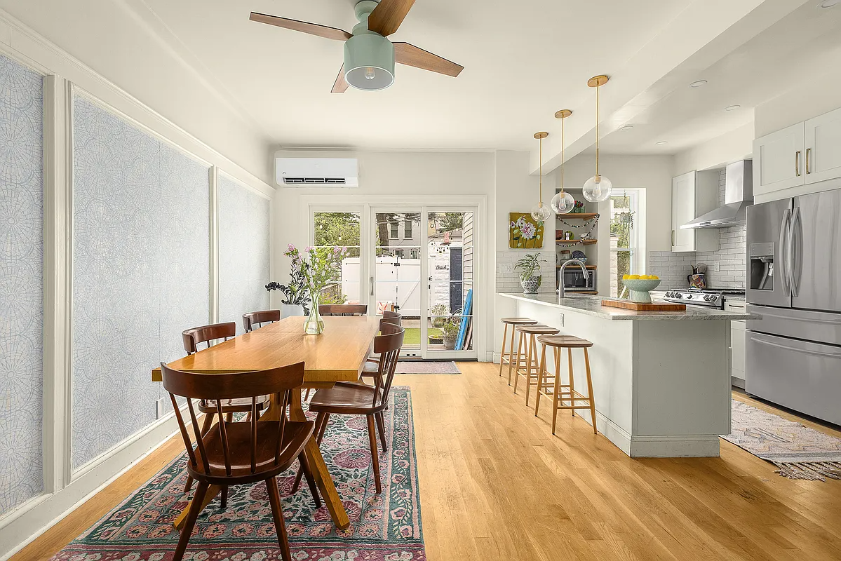 open plan kitchen and dining room with a peninsula dividing the two