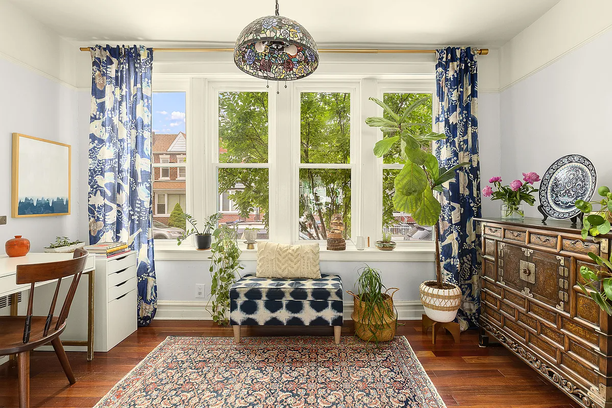 sunroom with room for seating and a desk