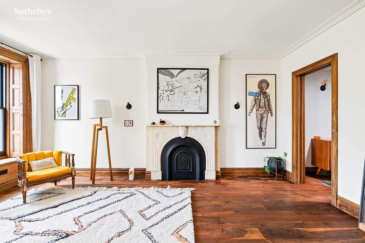 bedroom with a marble mantel