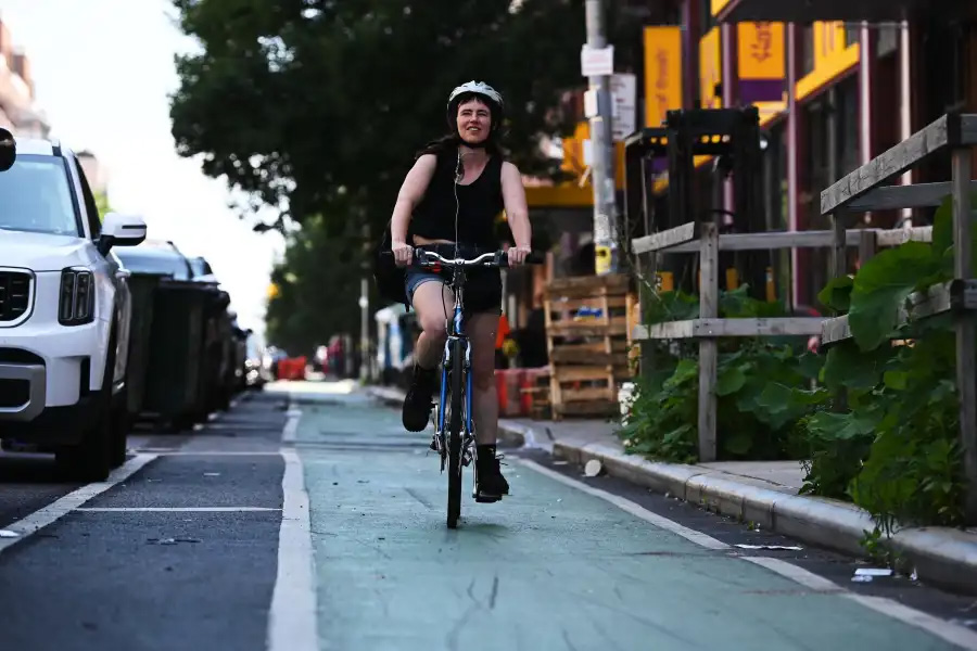 a biker on a protected bike lane