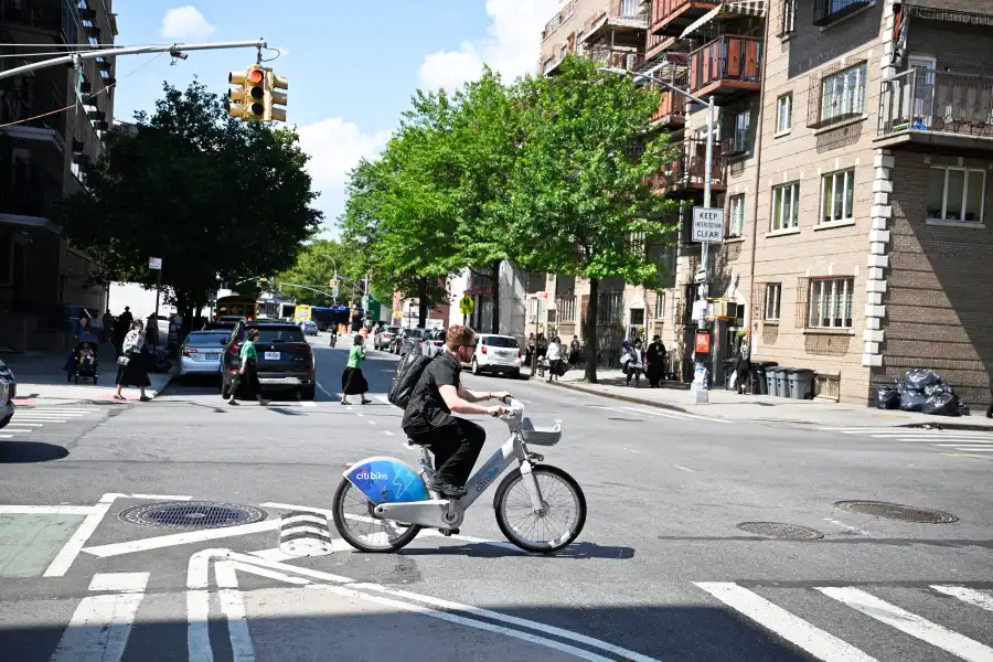 a biker crossing a street