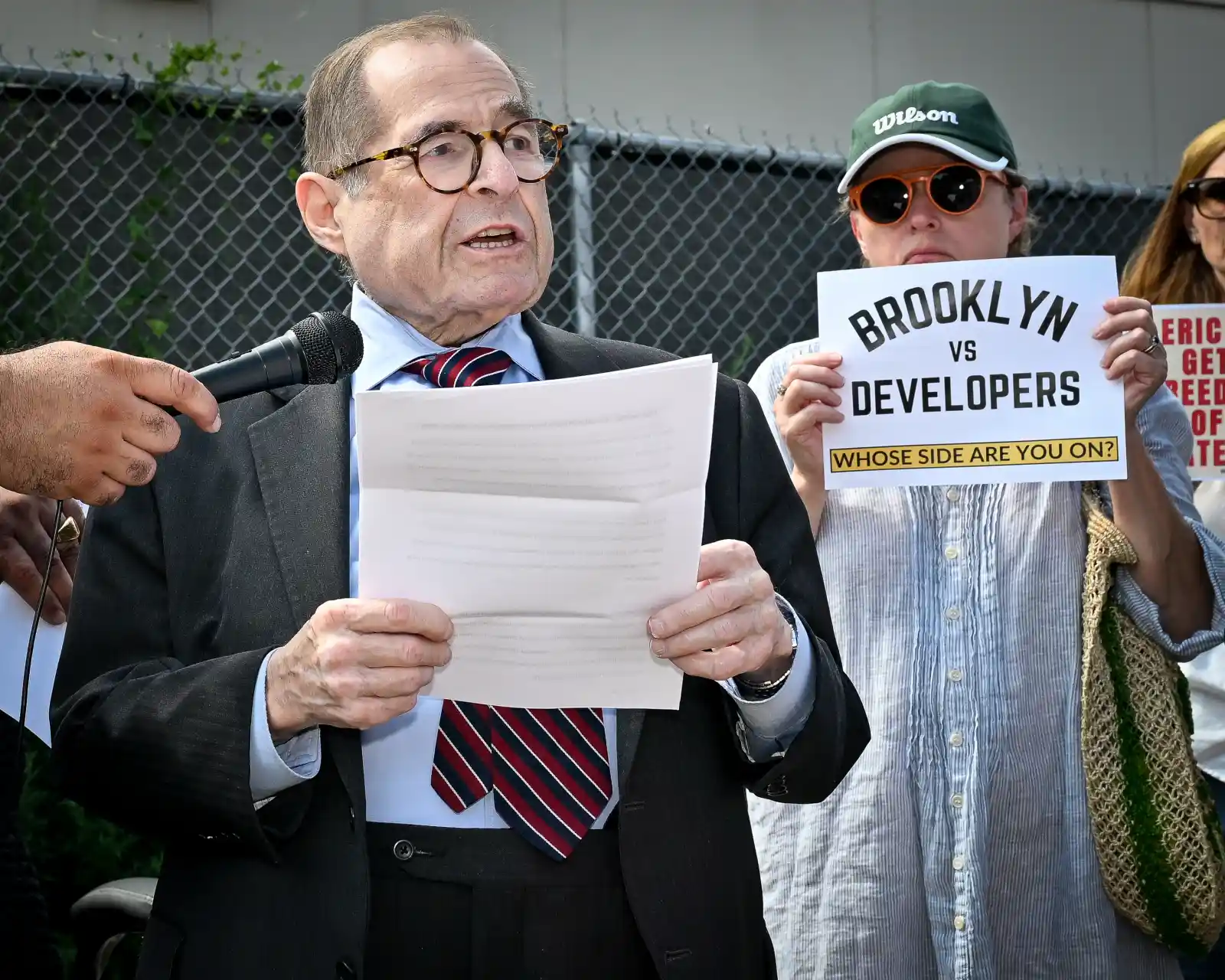 politician speaking at protest