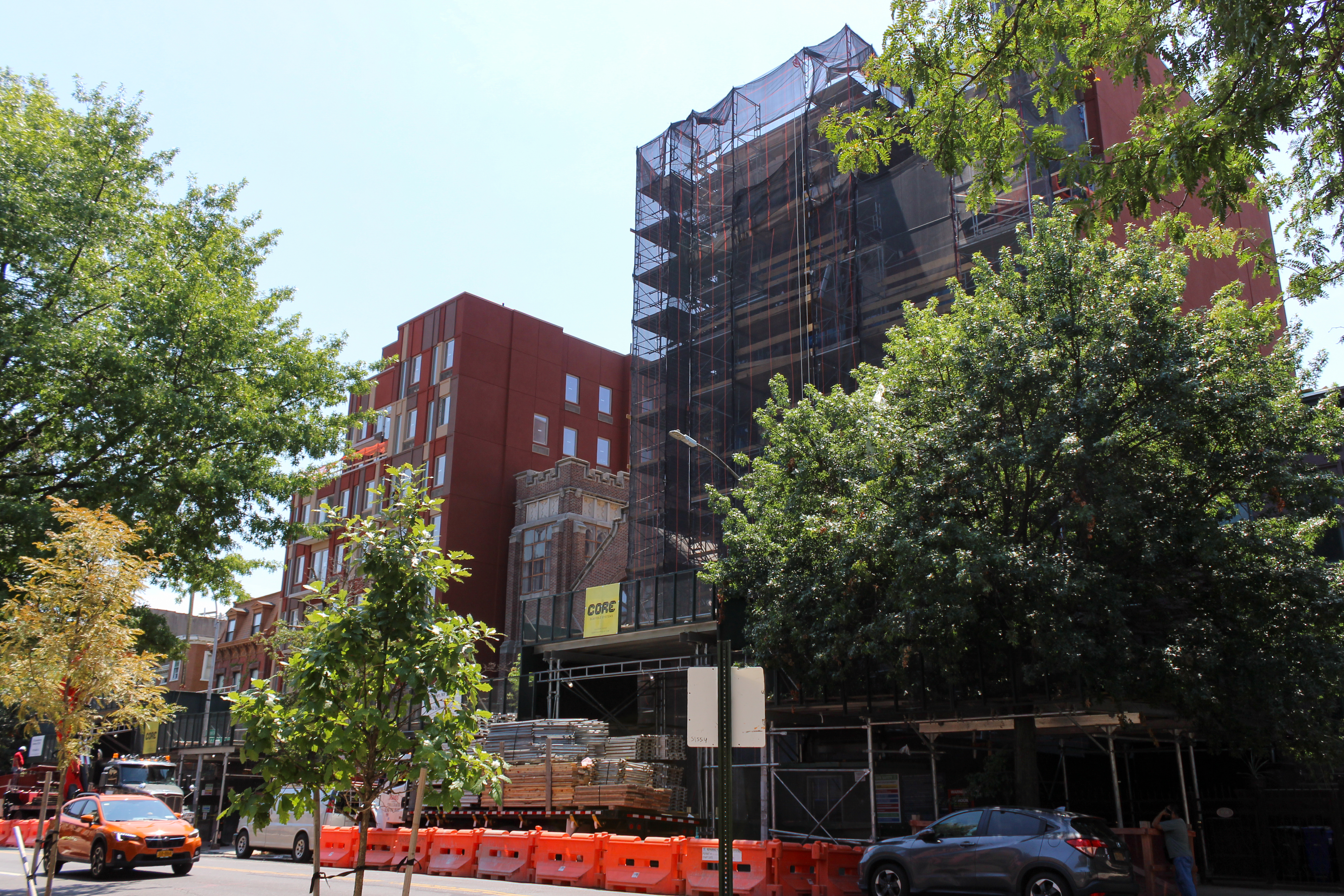 construction fencing and scaffolding around a building under construction