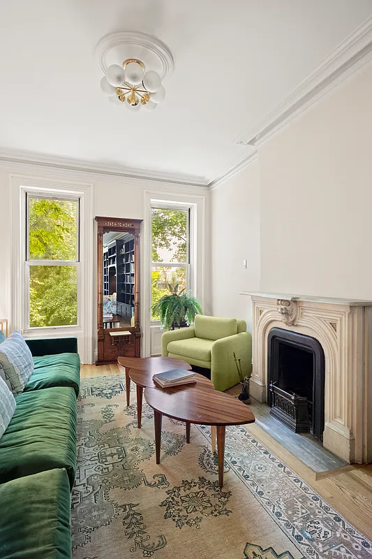 rear of parlor level with a marble mantel, ceiling medallion