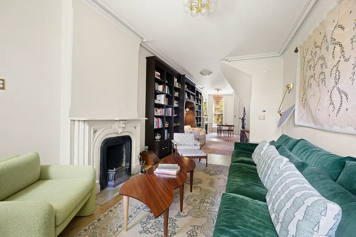 parlor level with a marble mantel and a seating area
