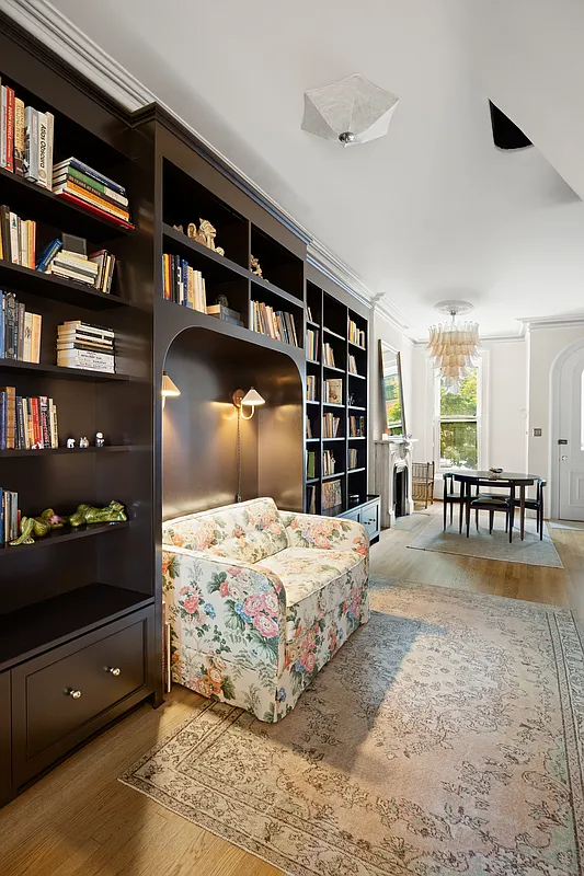 bookcases on the parlor level with niche for a love seat