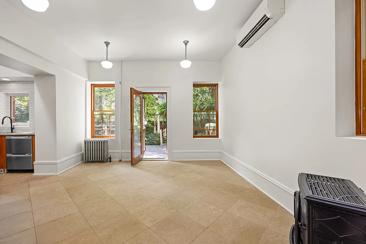 kitchen with tile floor and door to the rear yard