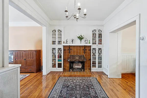 middle parlor with a mantel and built-in bookcases