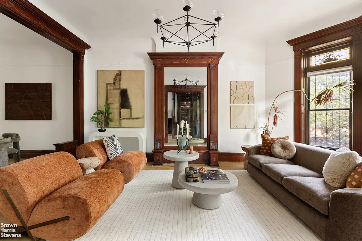 parlor with a pier mirror and white walls
