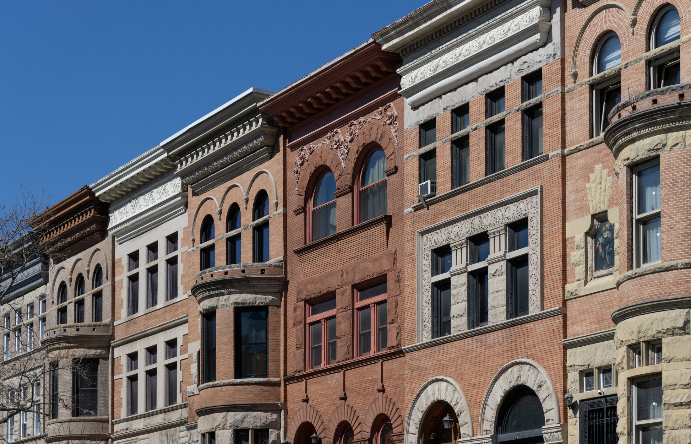 brick rowhouses with ornate facades