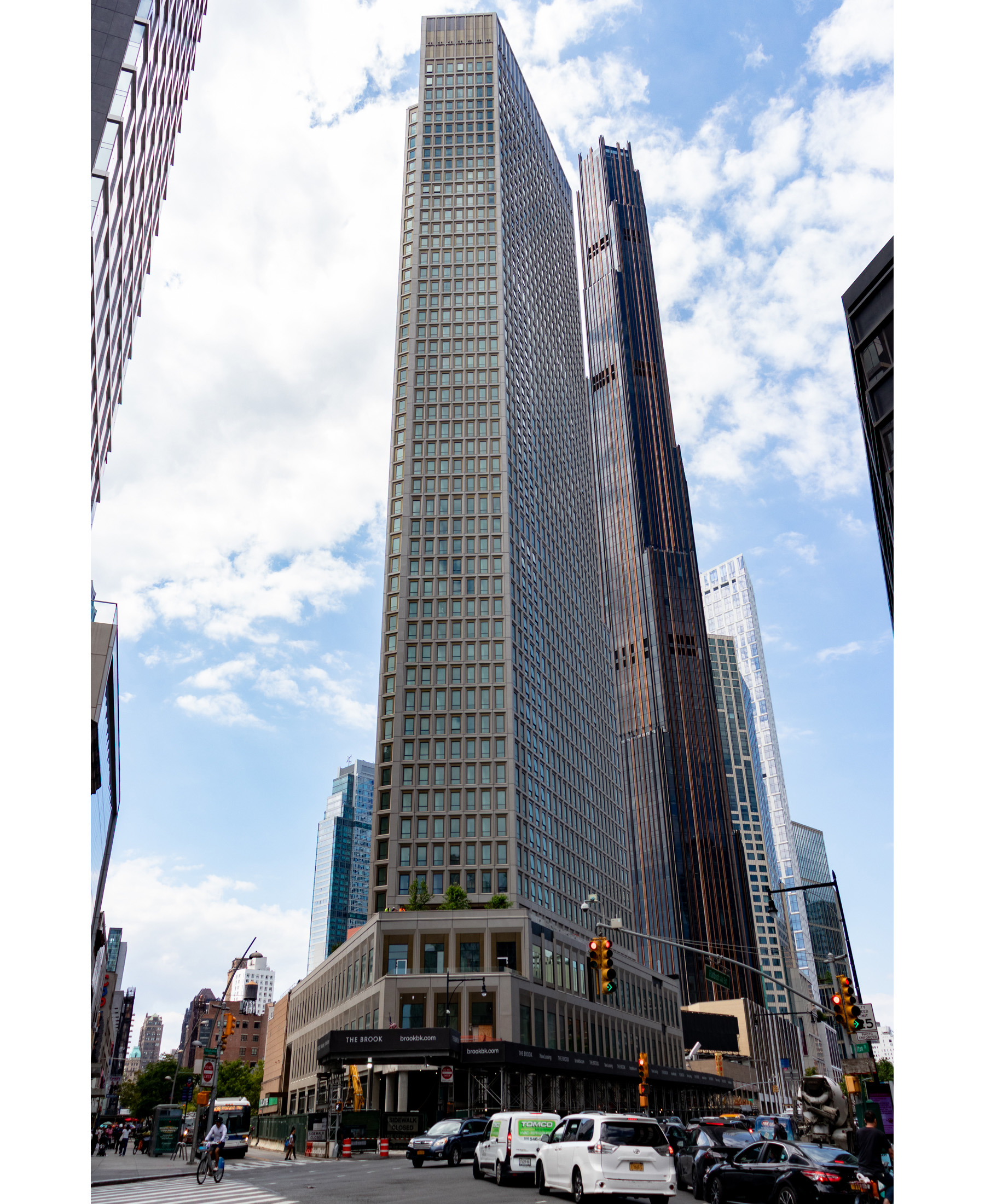 multi story tower with busy traffic in front of it