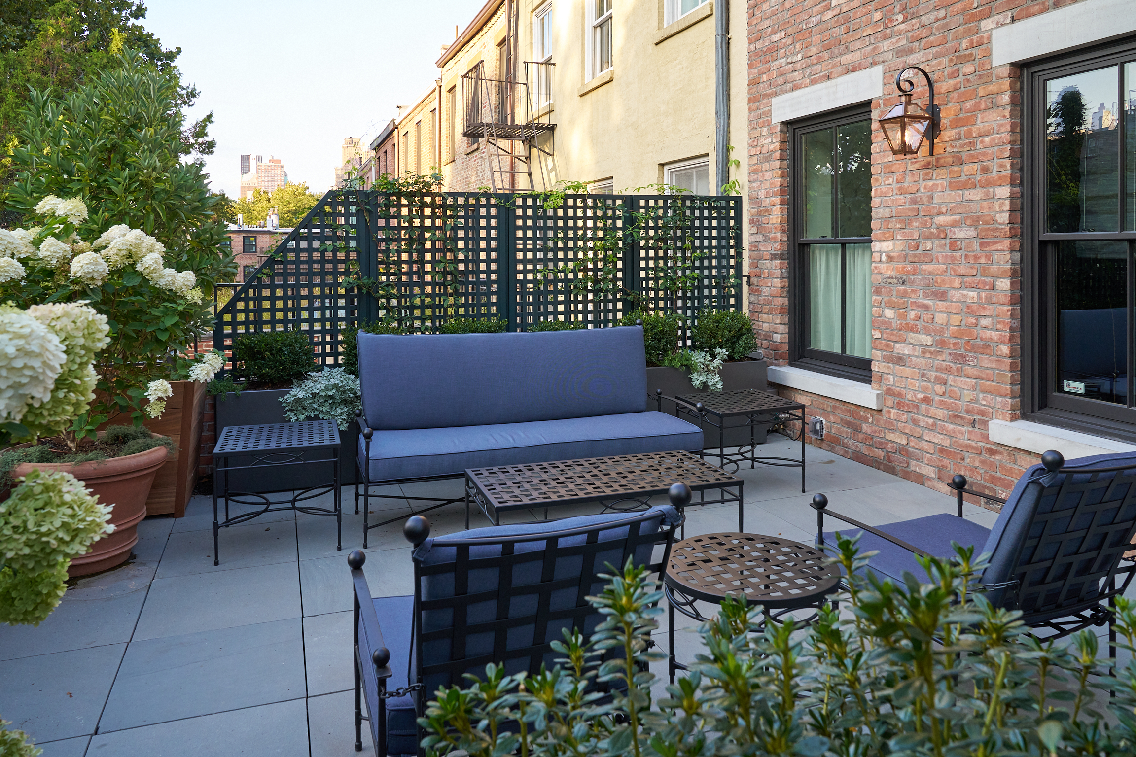 DECK WITH BLUE FURNITURE PRIVACY FENCE
