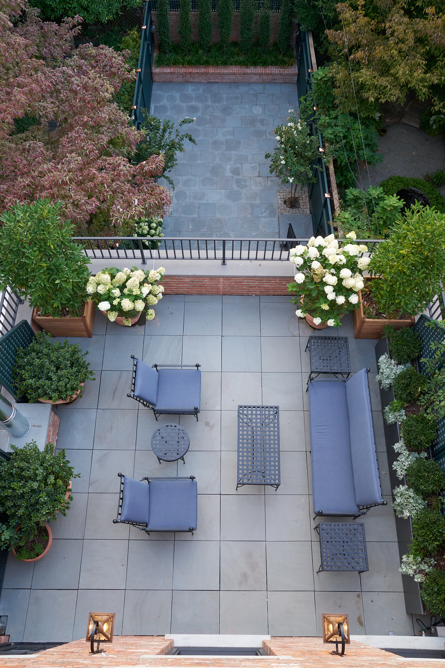 LOOKING DOWN FROM TOP DECK TO MID DECK AND BACK YARD