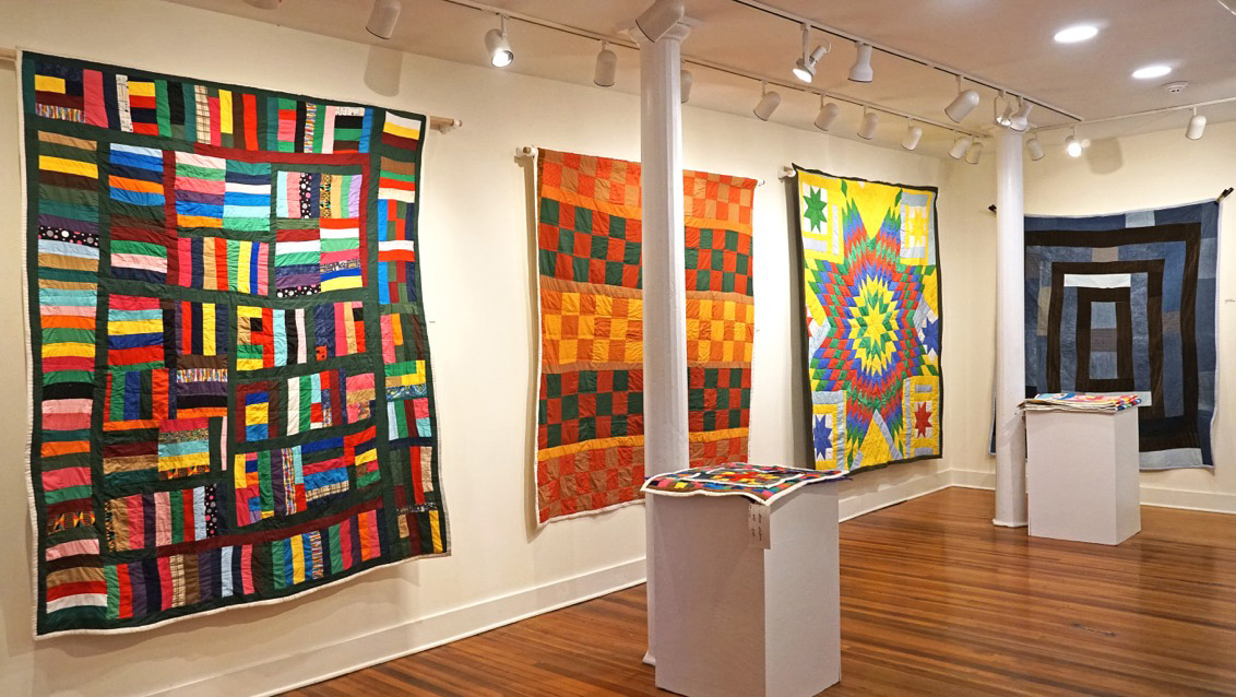 colorful quilts hanging