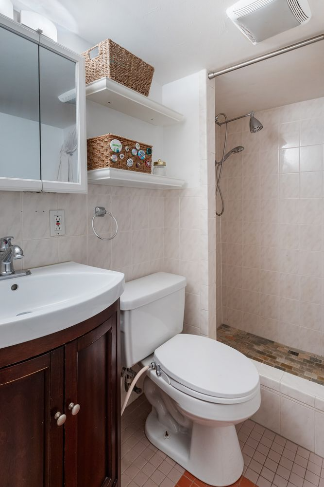 bathroom with wood vanity