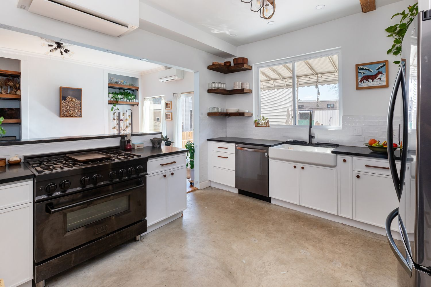kitchen with white cabinets, apron front sink, dishwasher