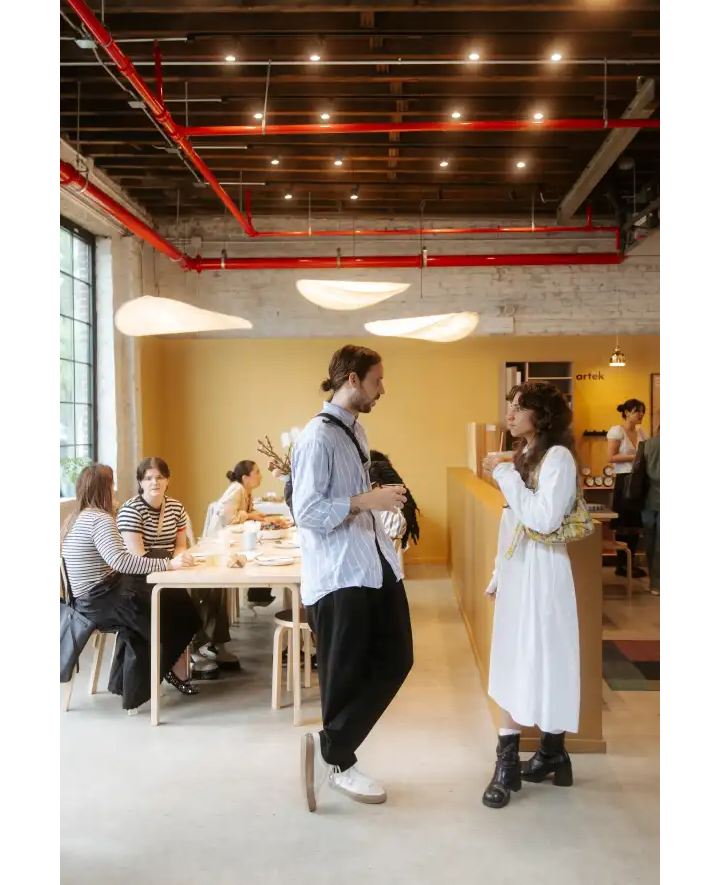 people standing in a cafe