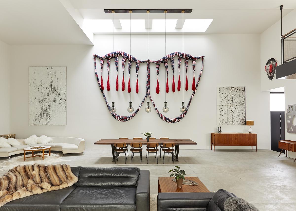 LIVING ROOM CORNER WITH SKYLIGHT POP ARTWORK