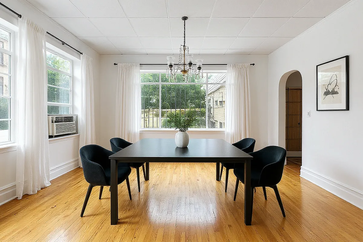a virtually staged dining room with two exposures and a black table and chairs